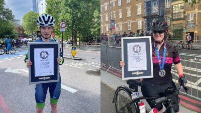 Two athletes showing their awards. 