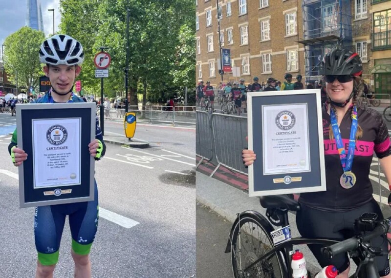 Two athletes showing their awards. 