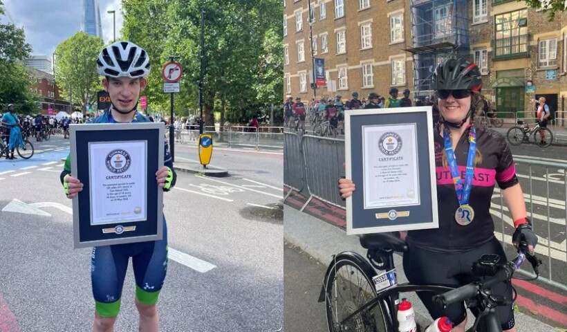 Two athletes showing their awards. 