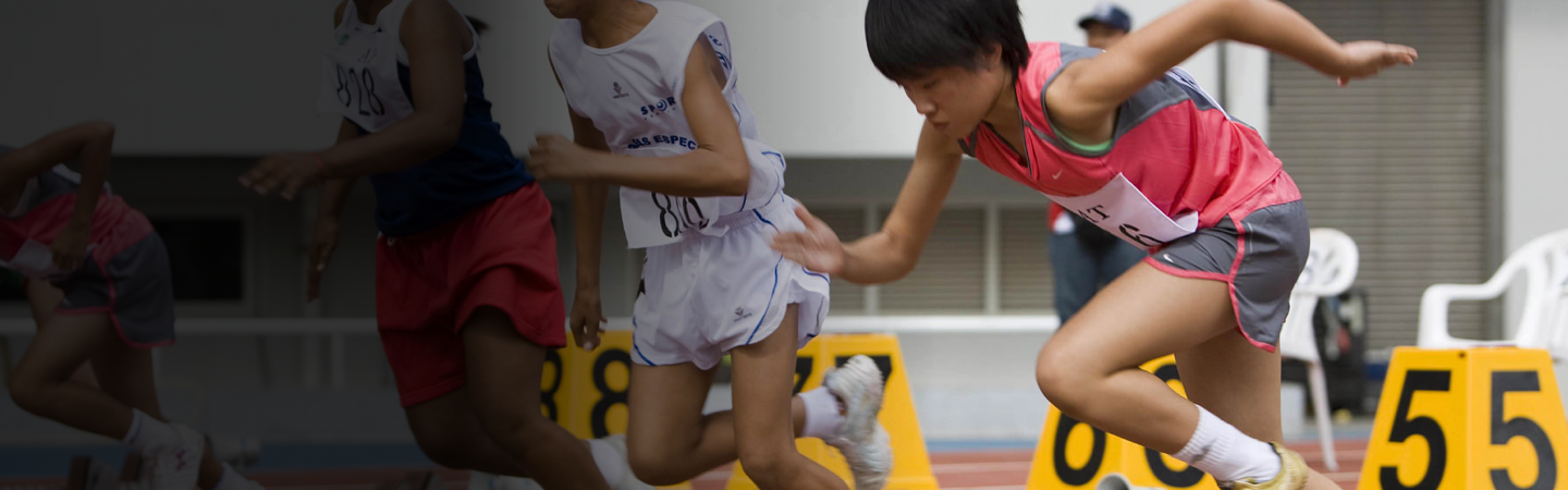 Young athletes running; Get Involved with your Special Olympics program banner