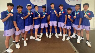 Group of young men showing their medals off. 