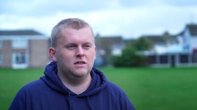 young man on the pitch being interviewed