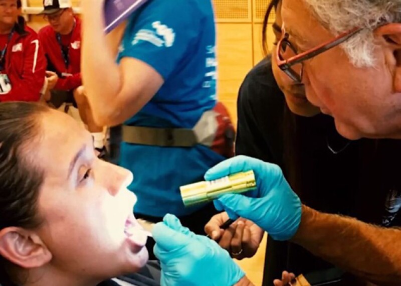 Dr. Perlman evaluating an athletes oral health. Healthy Athletes, Special Smiles