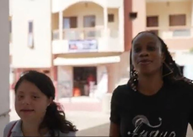 Two young women walking. 