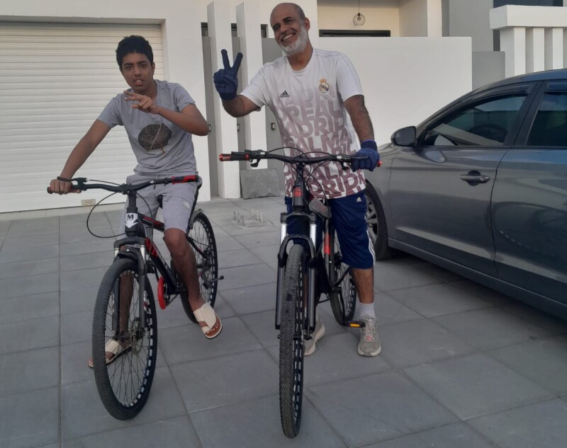 Father and son on bikes