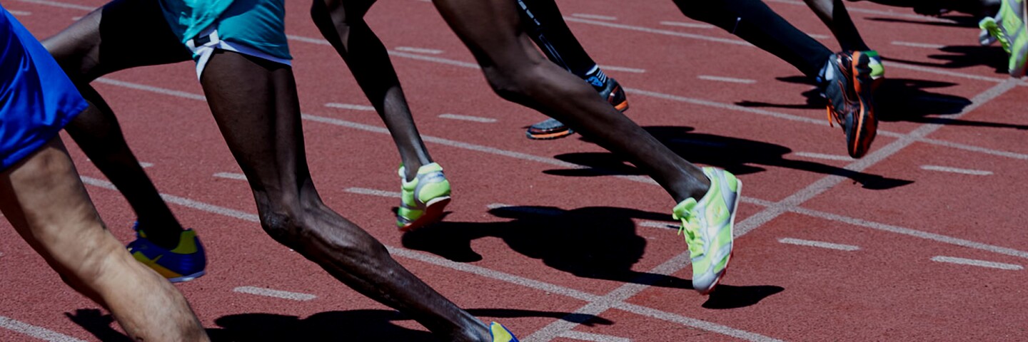 Runners taking their first step in a race. 